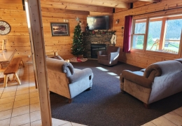 Living room complete with gas fireplace and futon sleeper (linens included)