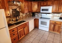 Modern kitchen with quartz countertop and farmhouse sink