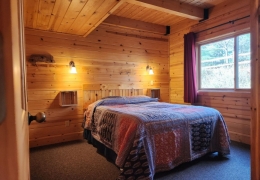 Main level queen bedroom with sink and mirror