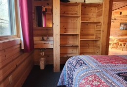 Built-in shelves with a sink and mirror in all bedrooms