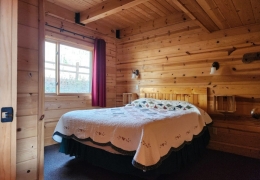 Main level queen bedroom with sink and mirror