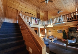 Upstairs sleeping loft with two bedrooms and one bathroom