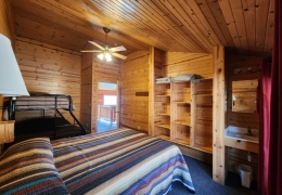 Upstairs queen bedroom with a twin over full bunk bed (sink, mirror and built-in shelving in each bedroom)