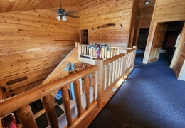 Upstairs loft area and hallway to bathroom and bedrooms