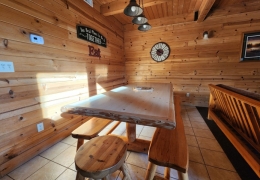 8 foot oak table in open concept kitchen and living room