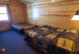 Upstairs queen bedroom with a futon bed (linens included)