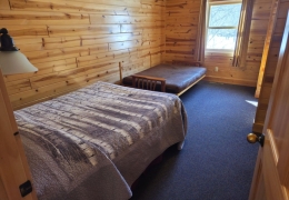 Upstairs queen bedroom with a futon bed (linens included)
