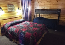 Lower level queen bedroom with a twin over full bunk