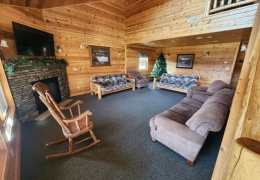Large family gathering space with a gas fireplace for story time