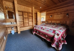 Queen bedroom with built-in storage and vanity area