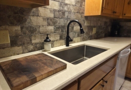 Modern kitchen with quartz countertop and farmhouse sink
