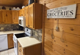 Modern kitchen stocked with baking & cooking essentials (pots, pans, dishes, stemware, etc)