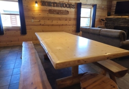 8 foot log table in open concept kitchen and living room