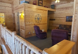 Upper level loft area with futon bed (linens & pillows included)