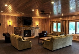 Lower level fireplace and walk out deck in the Big Timber Cabin