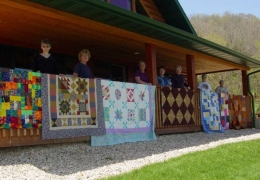 Quilters showing their beautiful creations