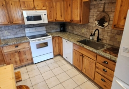 Modern kitchen with quartz countertop and farmhouse sink