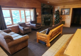 Living room complete with gas fireplace and futon sleeper (linens included)