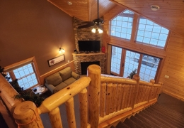 Open staircase overlooking living room area