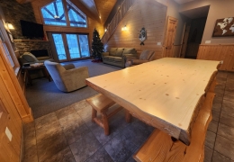 8 foot oak table in open concept kitchen and living room