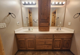 Main level on suite bathroom with separate shower and closet area