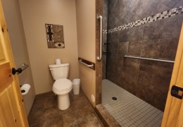 Main level on suite bathroom with separate shower and closet area