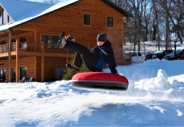 Catching some air on the tubing hill