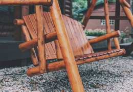 Oak swing in the picnic area near the cabin's firepit