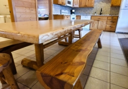 8 foot oak table in open concept kitchen and living room
