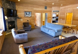 Open concept living room & kitchen space with a gas fireplace